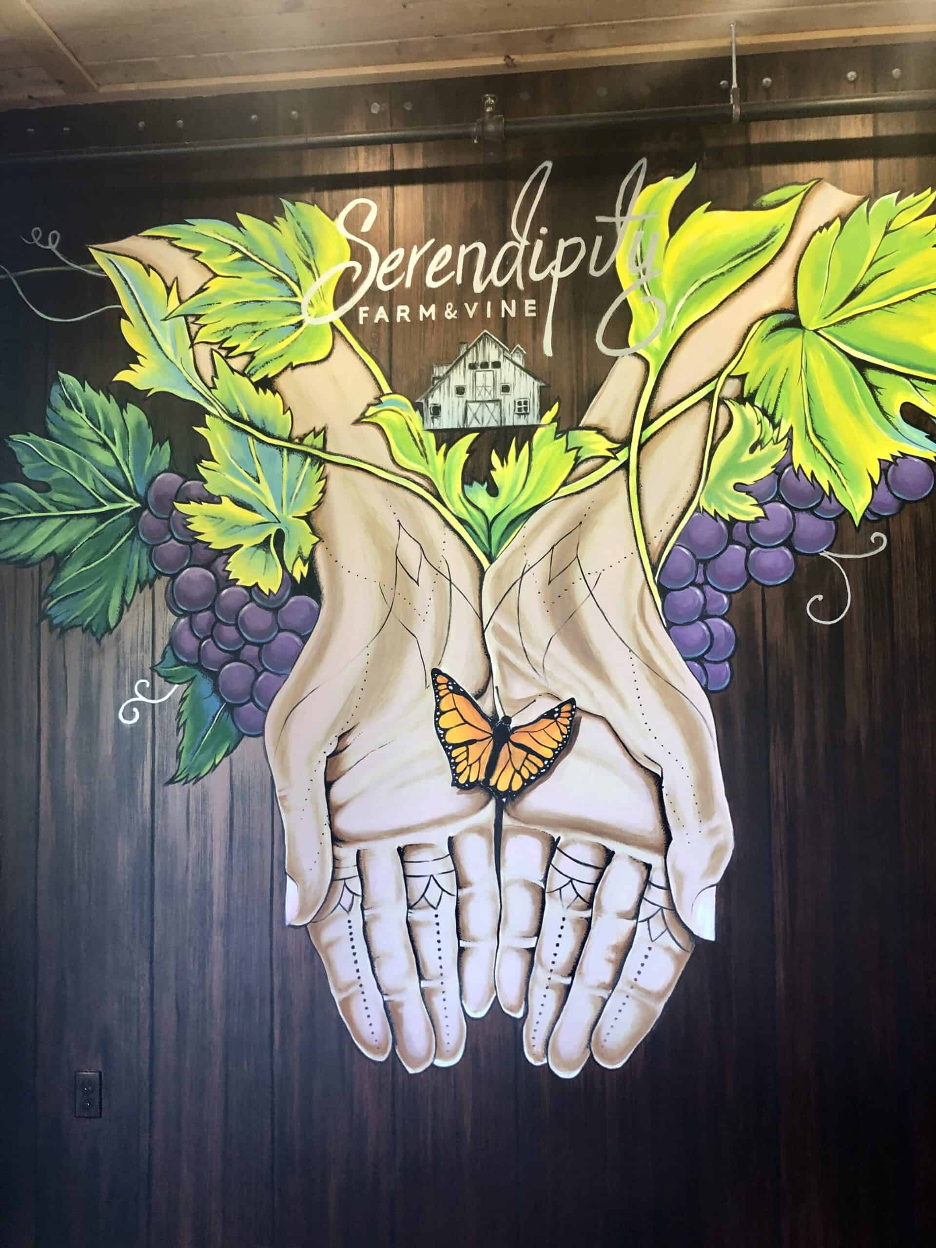 mural of hands holding a butterfly