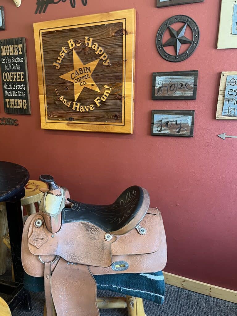 saddle seat at table in Cabin Coffee in Clear Lake Iowa