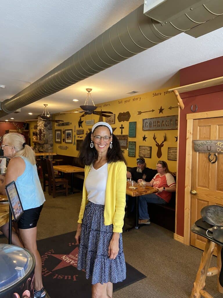 woman standing in Cabin Coffee in Clear Lake Iowa