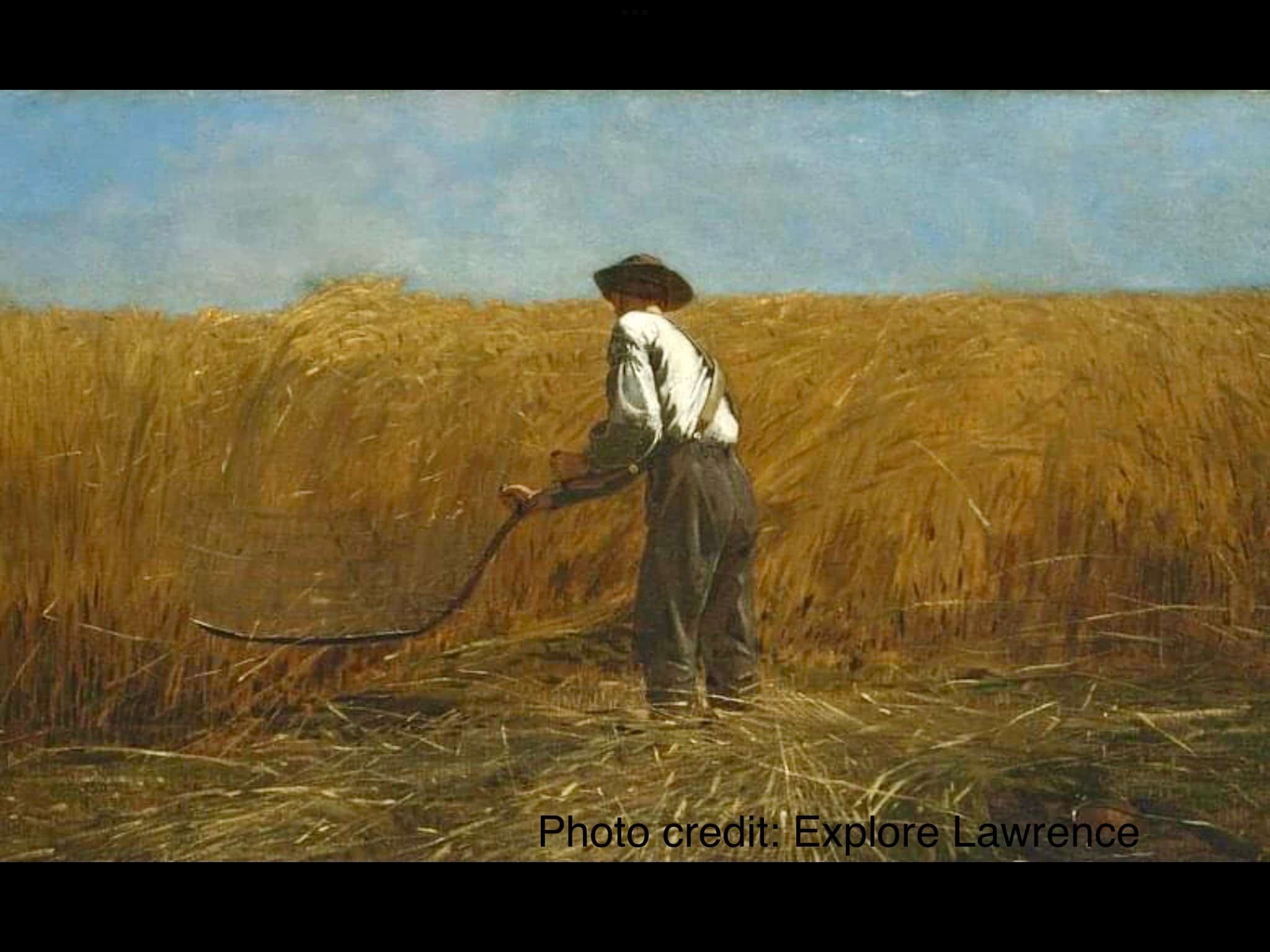 farmer scything hay