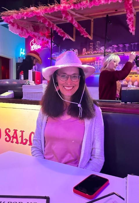 woman with pink cowgirl hat