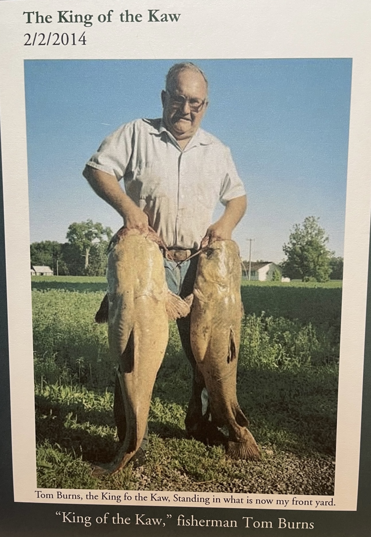 photo of a man noodling catfish